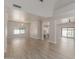Open-concept living area featuring wood-look floors and seamless flow to the kitchen at 742 W Vineyard Plains Dr, San Tan Valley, AZ 85143