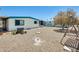 Backyard featuring a rock landscape, mature tree, and room to personalize at 8103 E Southern Ave # 170, Mesa, AZ 85209