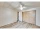 Well-lit bedroom with hardwood flooring, ceiling fan, and closet at 8103 E Southern Ave # 170, Mesa, AZ 85209