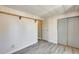 This bedroom features light gray laminate floors and neutral walls at 8103 E Southern Ave # 170, Mesa, AZ 85209