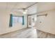 Well-lit bedroom with hardwood flooring, ceiling fan, and window at 8103 E Southern Ave # 170, Mesa, AZ 85209
