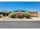 Charming single-story home with lovely landscaping, covered parking, and light blue trim at 8103 E Southern Ave # 170, Mesa, AZ 85209