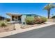 Inviting single-story home showcasing landscaping, a covered parking area, and light blue trim at 8103 E Southern Ave # 170, Mesa, AZ 85209