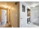 Hallway leading to laundry area featuring washer and dryer appliances at 8103 E Southern Ave # 170, Mesa, AZ 85209