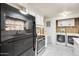 Bright kitchen featuring white cabinetry and a black refrigerator and stove at 8103 E Southern Ave # 170, Mesa, AZ 85209