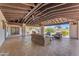 Spacious outdoor patio with comfortable seating, offering views of the manicured backyard at 8213 E Sharon Dr, Scottsdale, AZ 85260