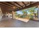 Covered patio opens to a serene desert garden and pool, perfect for outdoor living and entertaining at 8213 E Sharon Dr, Scottsdale, AZ 85260