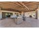 A covered patio featuring lounge furniture, providing an inviting outdoor living space at 8213 E Sharon Dr, Scottsdale, AZ 85260