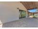 Spacious patio with brick flooring, connecting seamlessly to a beautiful outdoor setting at 8213 E Sharon Dr, Scottsdale, AZ 85260