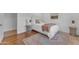 Charming bedroom featuring hardwood floors, a plush bed, and decorative side tables at 8213 E Sharon Dr, Scottsdale, AZ 85260