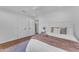 Inviting bedroom with hardwood floors, and a plush bed with a decorative throw at 8213 E Sharon Dr, Scottsdale, AZ 85260