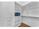 Organized walk-in closet with built-in shelving and ample storage space at 8213 E Sharon Dr, Scottsdale, AZ 85260