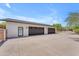 Attached 3-car garage with ample parking space and gate access at 8213 E Sharon Dr, Scottsdale, AZ 85260