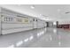 Expansive garage with bright lighting, plentiful windows, and a clean, epoxy-coated floor at 8213 E Sharon Dr, Scottsdale, AZ 85260