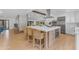 Open-concept kitchen boasts a large island with seating, modern appliances, and seamless flow into living spaces at 8213 E Sharon Dr, Scottsdale, AZ 85260