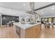 Spacious open-concept kitchen featuring a large island, stainless steel appliances, and seamless access to living areas at 8213 E Sharon Dr, Scottsdale, AZ 85260