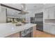 Open kitchen with large island, stainless steel appliances, and easy access to living and dining areas at 8213 E Sharon Dr, Scottsdale, AZ 85260