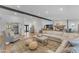Comfortable living room with an oversized sectional sofa, cozy seating, and chic decor on hardwood floors at 8213 E Sharon Dr, Scottsdale, AZ 85260