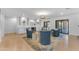 Bright living room featuring recessed lighting, four swivel chairs and sliding door access to the backyard at 8213 E Sharon Dr, Scottsdale, AZ 85260