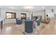 Open living room boasts a fireplace, wet bar and sliding door access to the backyard at 8213 E Sharon Dr, Scottsdale, AZ 85260