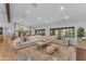 Spacious living room boasts a sprawling sectional sofa, stylish decor, and hardwood flooring for a modern feel at 8213 E Sharon Dr, Scottsdale, AZ 85260