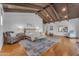 Open main bedroom offers vaulted beamed ceilings, decorative lamps and plenty of natural light at 8213 E Sharon Dr, Scottsdale, AZ 85260