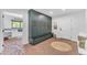 Mud room featuring green built-in lockers, brick floors, and a view into the laundry room at 8213 E Sharon Dr, Scottsdale, AZ 85260