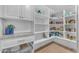 Well-organized pantry with white cabinets and open shelving provides ample storage space at 8213 E Sharon Dr, Scottsdale, AZ 85260