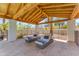 Relaxing covered patio with stylish lounge chairs, perfect for outdoor enjoyment at 8213 E Sharon Dr, Scottsdale, AZ 85260