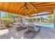 Inviting outdoor lounge area with comfortable seating and view of the sparkling pool at 8213 E Sharon Dr, Scottsdale, AZ 85260