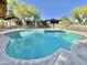 Large inviting pool perfect for relaxation and backyard oasis appeal, framed by desert landscape at 8213 E Sharon Dr, Scottsdale, AZ 85260