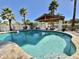 Inviting pool featuring a covered patio and desert landscaping for a relaxing outdoor experience at 8213 E Sharon Dr, Scottsdale, AZ 85260