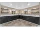 An expansive vanity area includes dual mirrors, sleek cabinetry, and ample counter space at 8213 E Sharon Dr, Scottsdale, AZ 85260