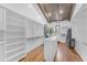 A spacious walk-in closet with custom shelving and storage solutions, and natural light at 8213 E Sharon Dr, Scottsdale, AZ 85260