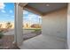 Relaxing covered patio with views of a spacious, landscaped backyard perfect for outdoor enjoyment at 8422 W Mantle Way, Florence, AZ 85132