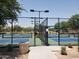 Outdoor pickleball courts enclosed by a chain-link fence, providing a secure and well-maintained recreational area at 8422 W Mantle Way, Florence, AZ 85132