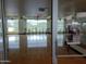 Modern spin room with rows of stationary bikes, large windows, and hardwood floors for an engaging workout at 8422 W Mantle Way, Florence, AZ 85132