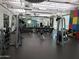 Spacious weight room with modern equipment, mirrors, and free weights for a comprehensive workout at 8422 W Mantle Way, Florence, AZ 85132