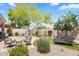Private backyard featuring comfortable seating, manicured desert landscaping, and stone ground cover at 8848 E Conquistadores Dr, Scottsdale, AZ 85255