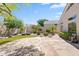 Open backyard with stone patio, seating area, and desert landscaping at 8848 E Conquistadores Dr, Scottsdale, AZ 85255