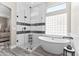 Bright bathroom boasts a glass shower, soaking tub, and decorative tile work at 8848 E Conquistadores Dr, Scottsdale, AZ 85255