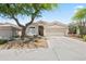 Charming single-story home with well-maintained landscaping, desert accents and a two-car garage at 8848 E Conquistadores Dr, Scottsdale, AZ 85255