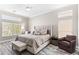 Serene main bedroom with neutral decor, hardwood-style floors, and plentiful natural light at 8848 E Conquistadores Dr, Scottsdale, AZ 85255