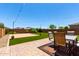 Lush backyard with a patio and well-maintained landscaping, perfect for enjoying the outdoors at 10625 S 55Th Dr, Laveen, AZ 85339