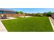 Sprawling backyard with a spacious lawn, offering plenty of room for outdoor fun and games at 10625 S 55Th Dr, Laveen, AZ 85339