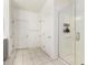 Clean bathroom with tiled floors, a glass-enclosed shower, and bright white walls at 10625 S 55Th Dr, Laveen, AZ 85339