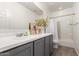 Bathroom features a modern vanity with ample countertop space and stylish fixtures at 10625 S 55Th Dr, Laveen, AZ 85339