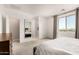 Bright bedroom featuring a plush bed, neutral walls, and ample natural light at 10625 S 55Th Dr, Laveen, AZ 85339