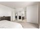Spacious bedroom featuring neutral walls, plush carpeting, and an ensuite bathroom at 10625 S 55Th Dr, Laveen, AZ 85339