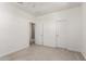 Bedroom is bright and features neutral carpet and light walls, offering a blank canvas for decorating at 10625 S 55Th Dr, Laveen, AZ 85339
